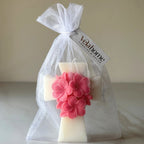 Vela Cruz con Flores en Bolsa de Organza