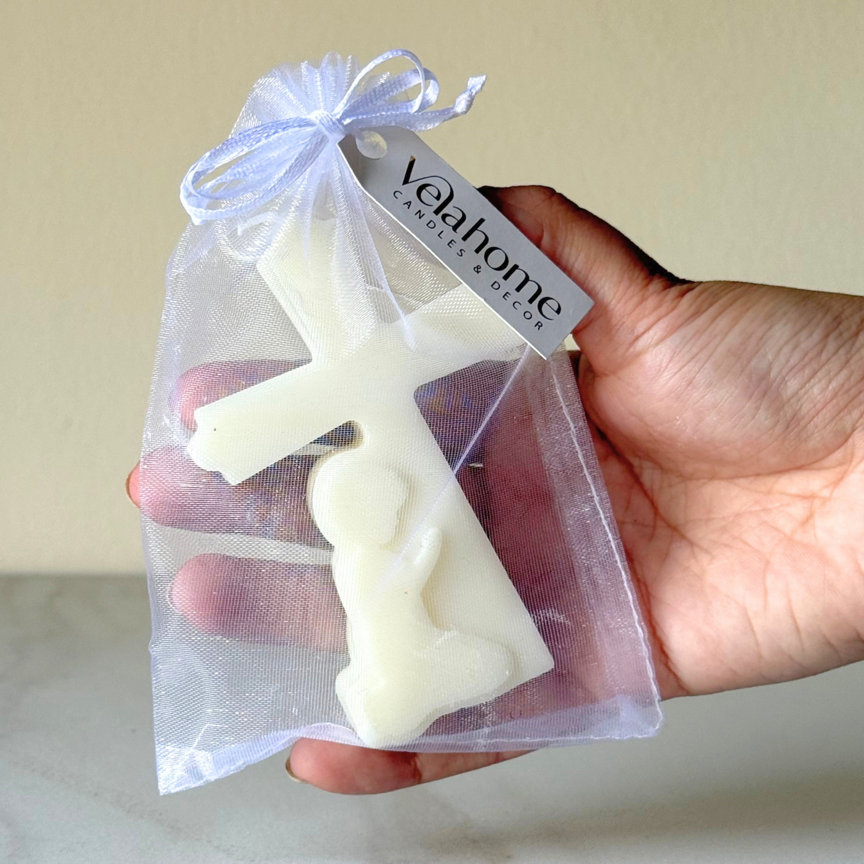 Vela Cruz con Niño en bolsa de organza